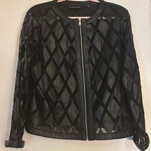 This is a stylish diamond cut shape patterned pleather jacket !